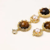 Gold-plated link bracelet with alternating brown tiger&